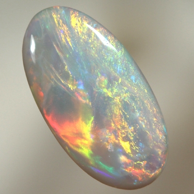 SOLID SEMI BLACK OPAL Orange and greens over ocean blue